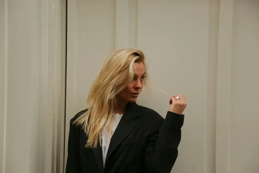 woman standing in an oversized blazer